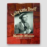 Sir-Norman-Wisdom-signed-book-‘Lucky-Little-Devil’,-Hardback